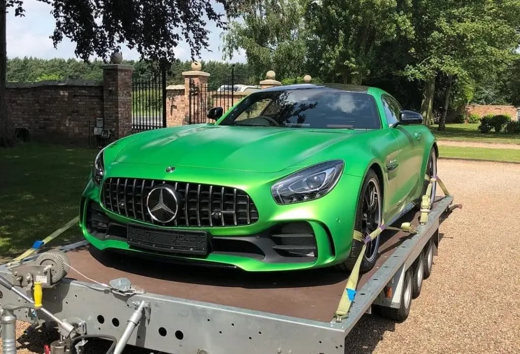A green Mercedes-AMG GT R loaded on an ICM trailer