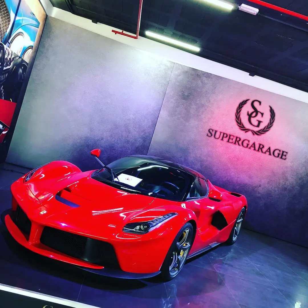 A red LaFerrari photographed in a showroom before collection